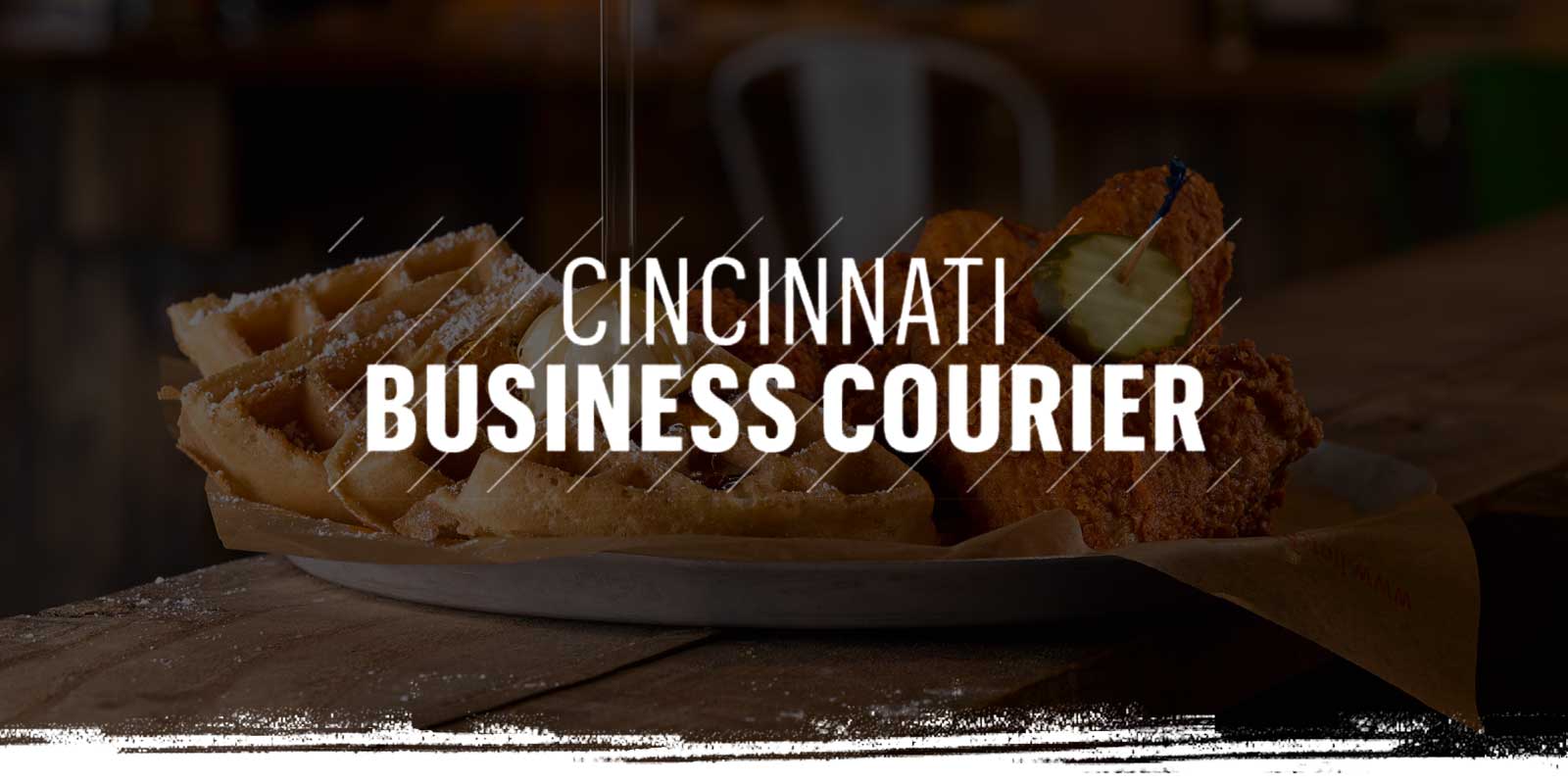 Cincinnati Business Courier logo on Chicken & Waffles background
